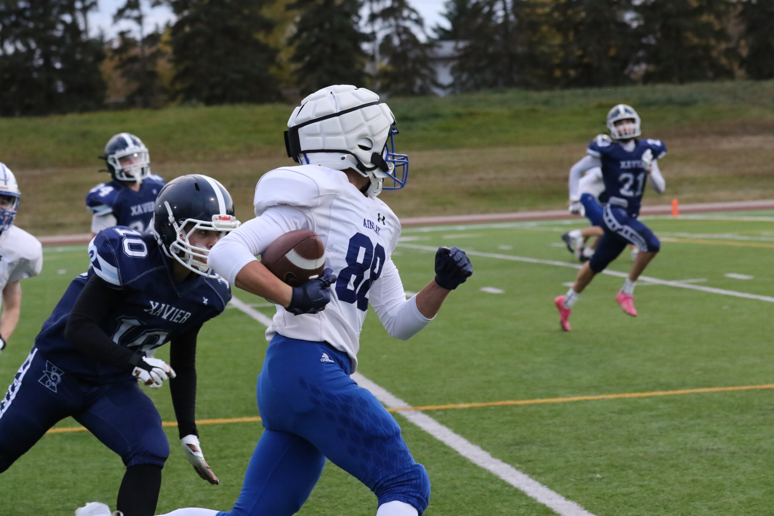 Junior Titans vs. St. Francis Xavier, Oct 7: player #82 running with the ball