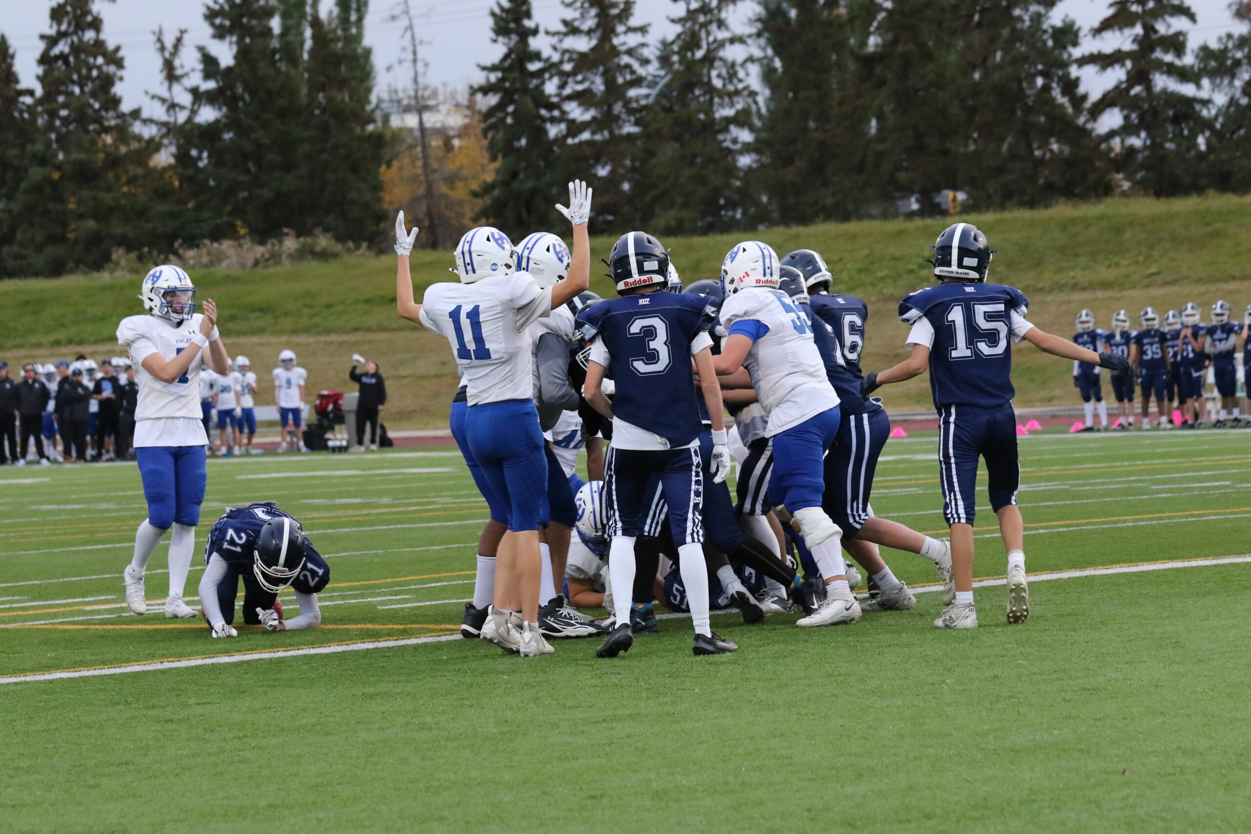Junior Titans vs. St. Francis Xavier, Oct 7: touchdown signalled by #11