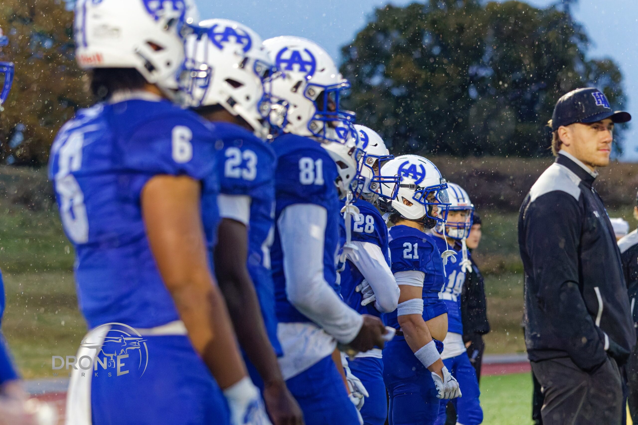 Senior Titans on the sideline in the rain, Oct 8